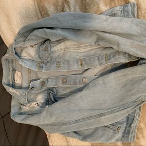Distressed light wash denim jacket